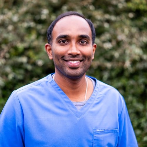 Man, dentist and hand with tablet in clinic, check medical records and appointment schedule. Male p