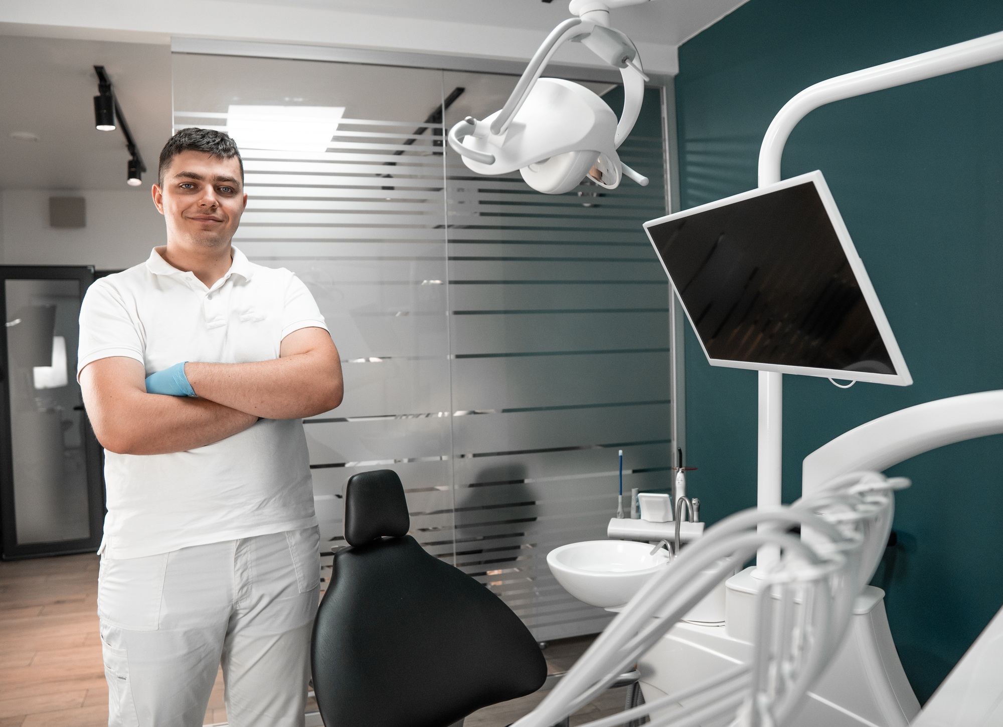 A dental expert at a dental care center fixes a patient's implants. A dental expert at a dental care