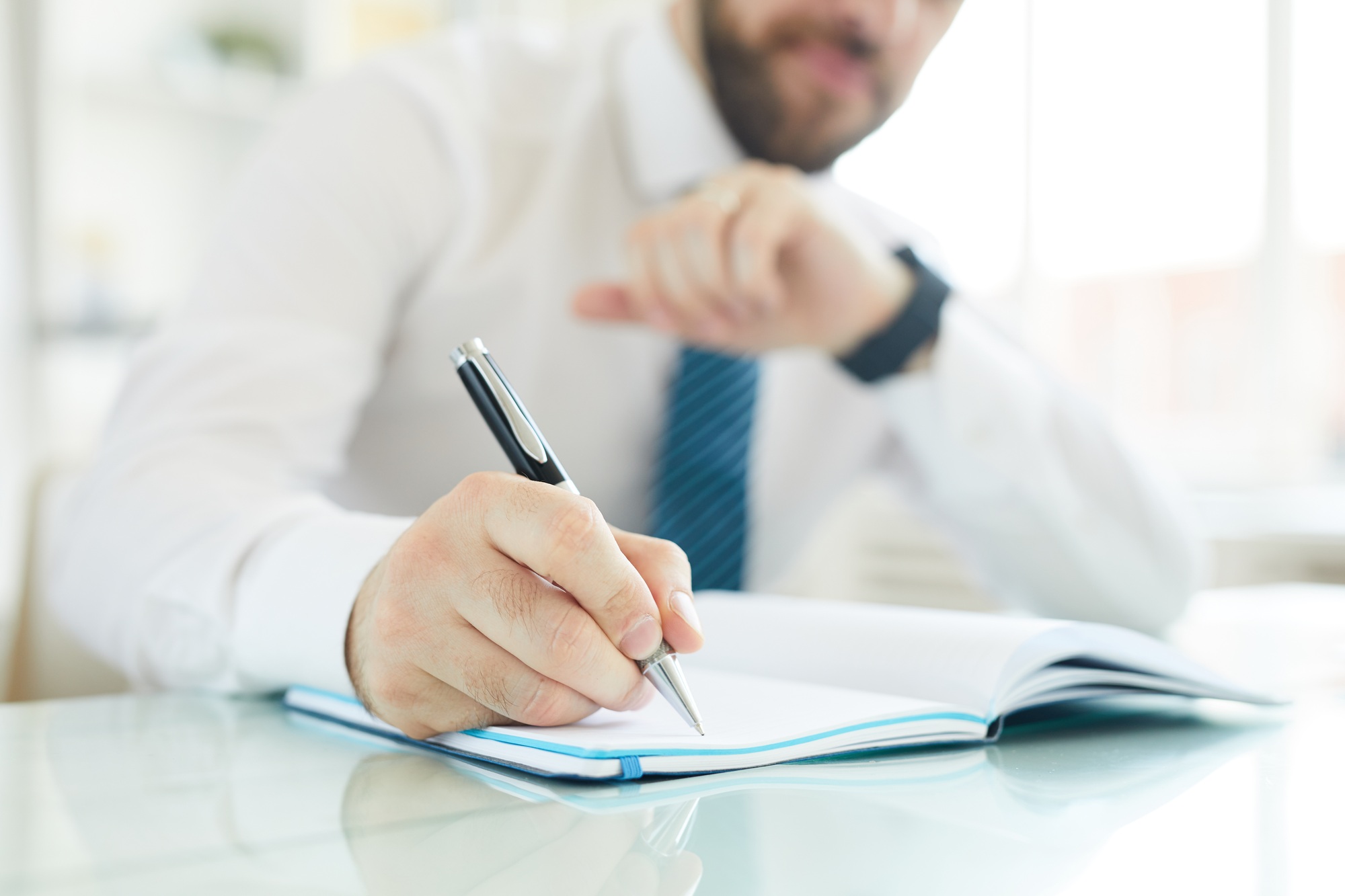 Businessman scheduling day in office