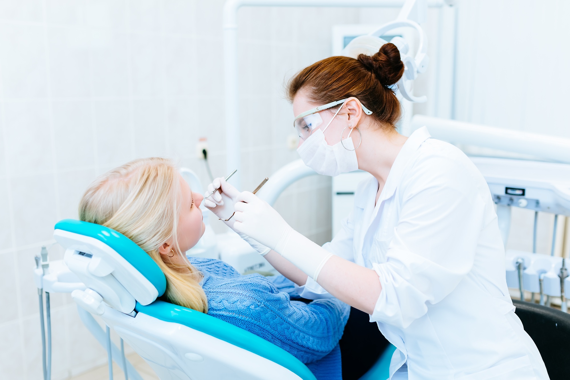 Dentist examining a patient's teeth in the clinic