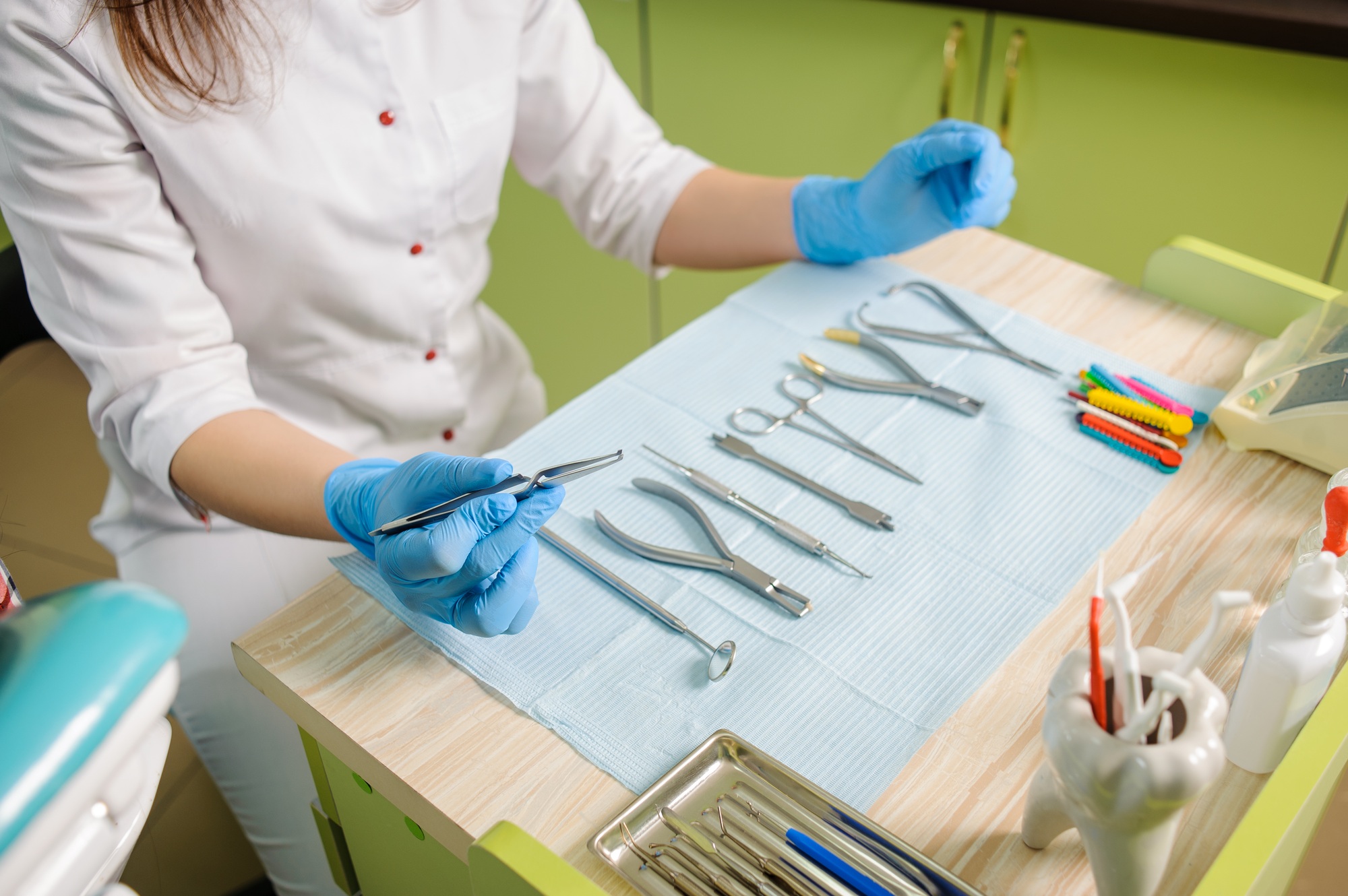 Different orthodontic instruments and tools in a dentist's office.