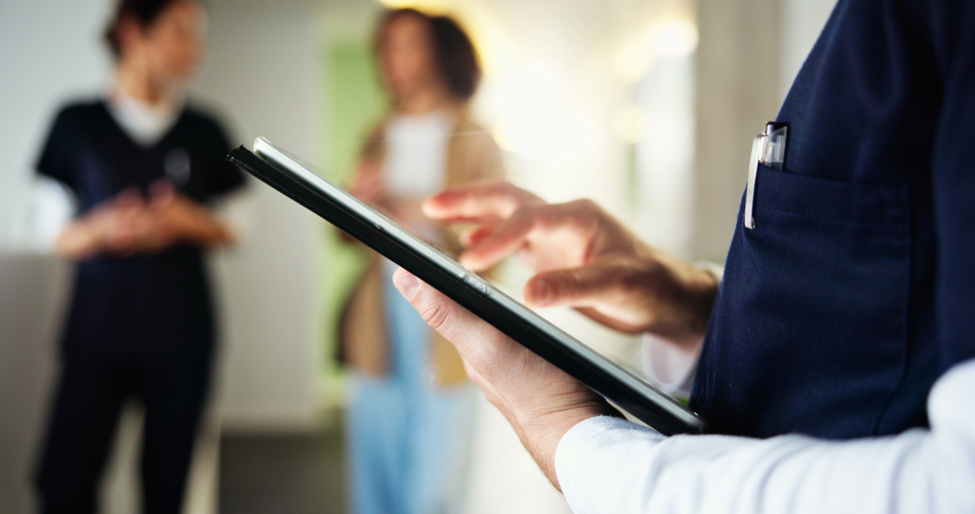 Man, dentist and hand with tablet in clinic, check medical records and appointment schedule. Male p
