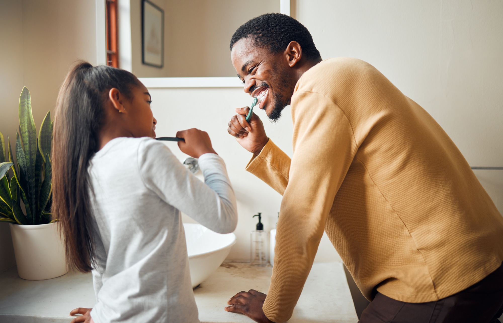 Oral care, brushing teeth and father with daughter in bathroom for hygiene, grooming and bonding. D