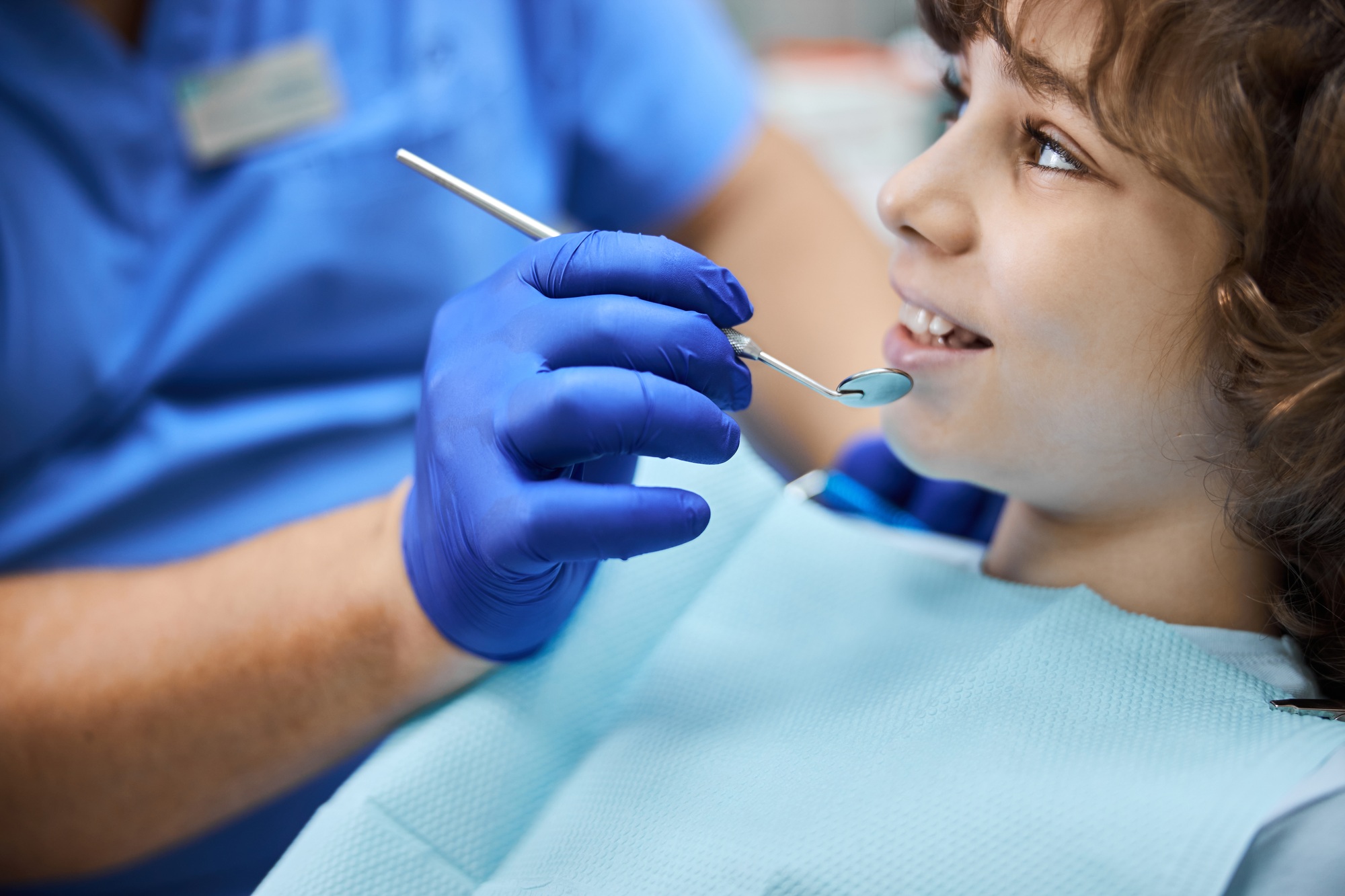 Adorable smiley kid during a dental examination