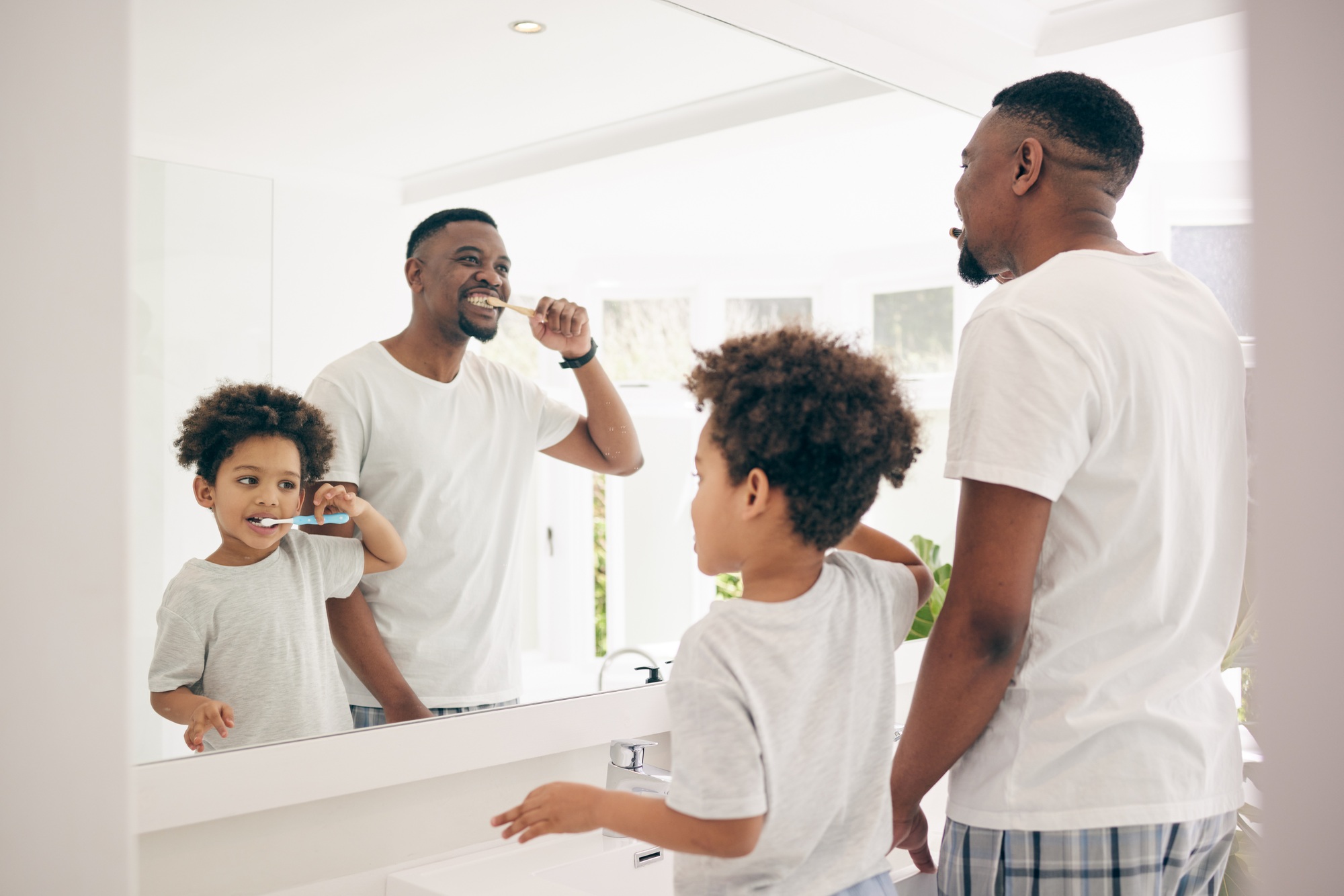 Brushing teeth, black family and cleaning morning routine in a bathroom with a dad and child. Hygie