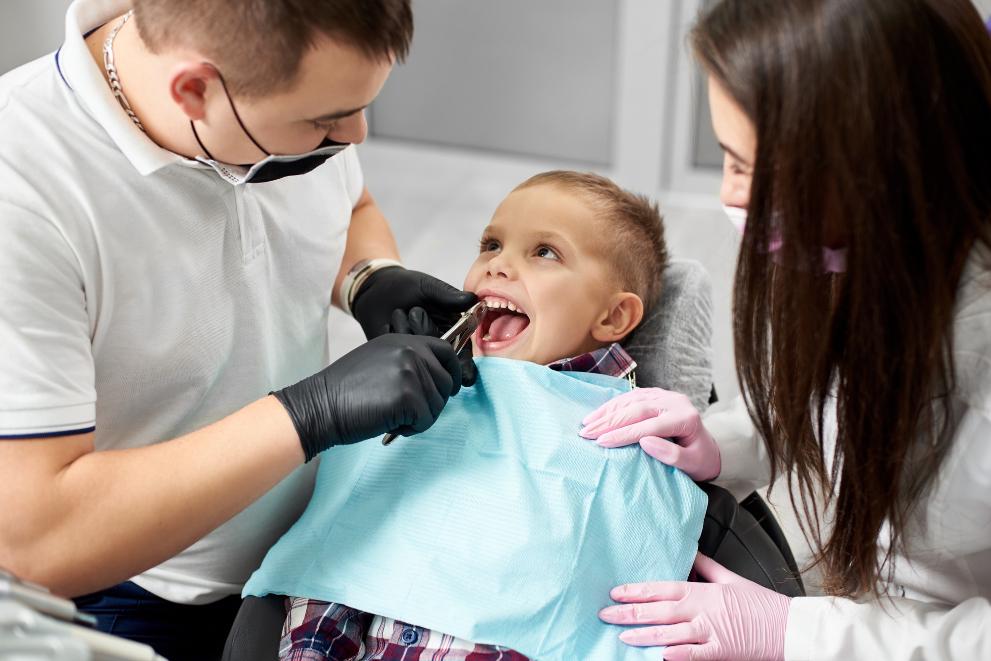 Dentist examining and filling teeth patients in clinic for better dental health and a bright smile.