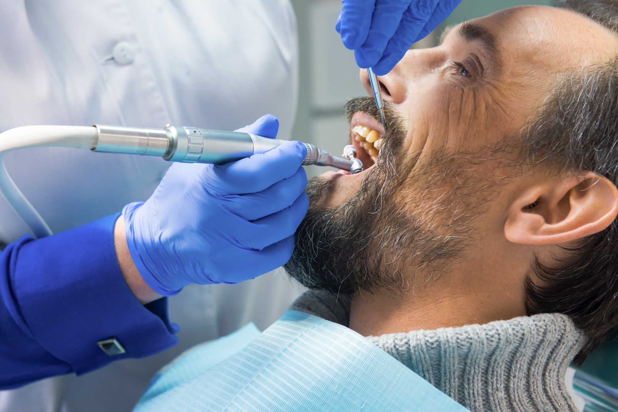 Dentist cleaning teeth