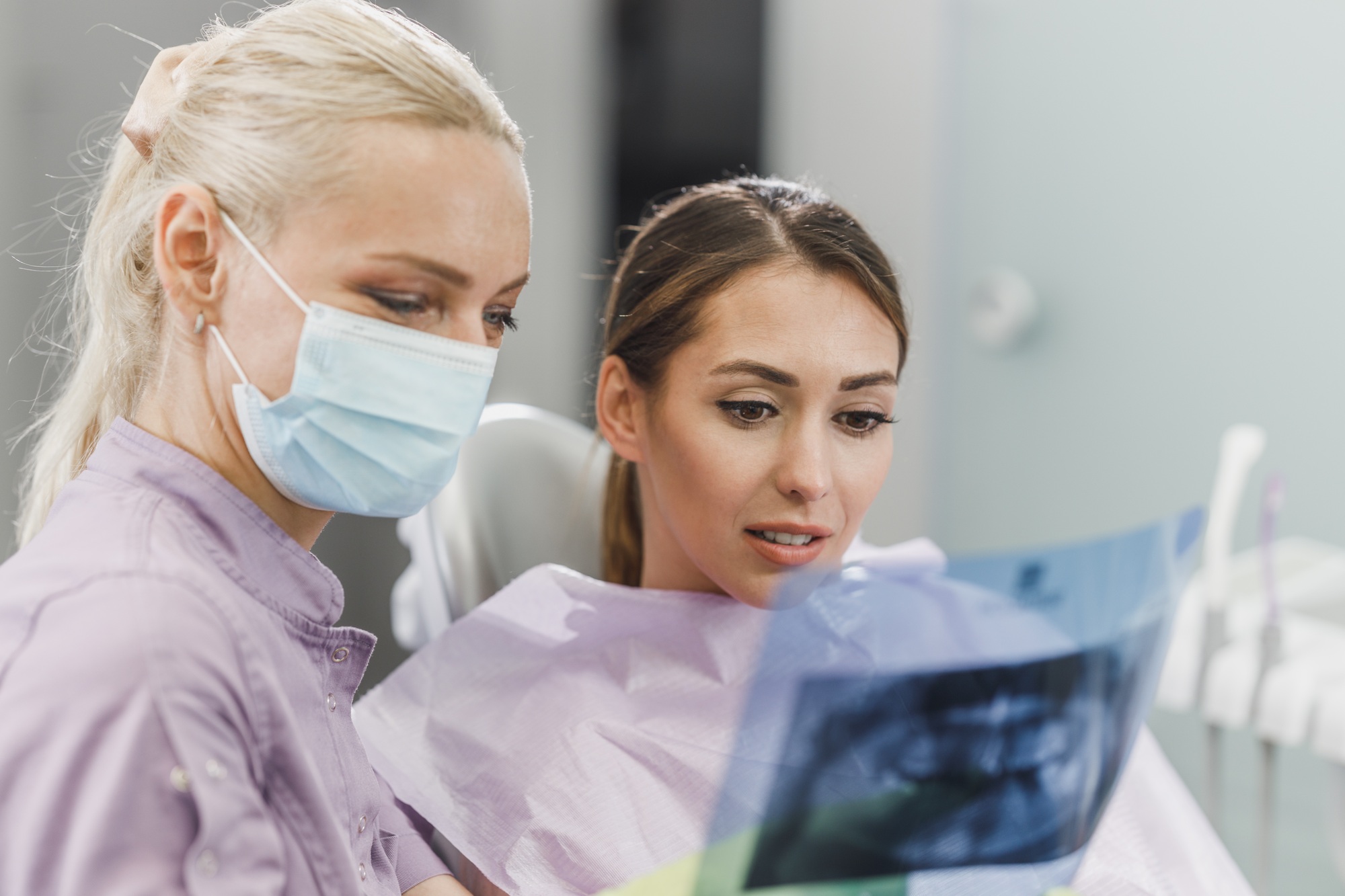 Dentist Explaining Tooth X-Rays To A Patient