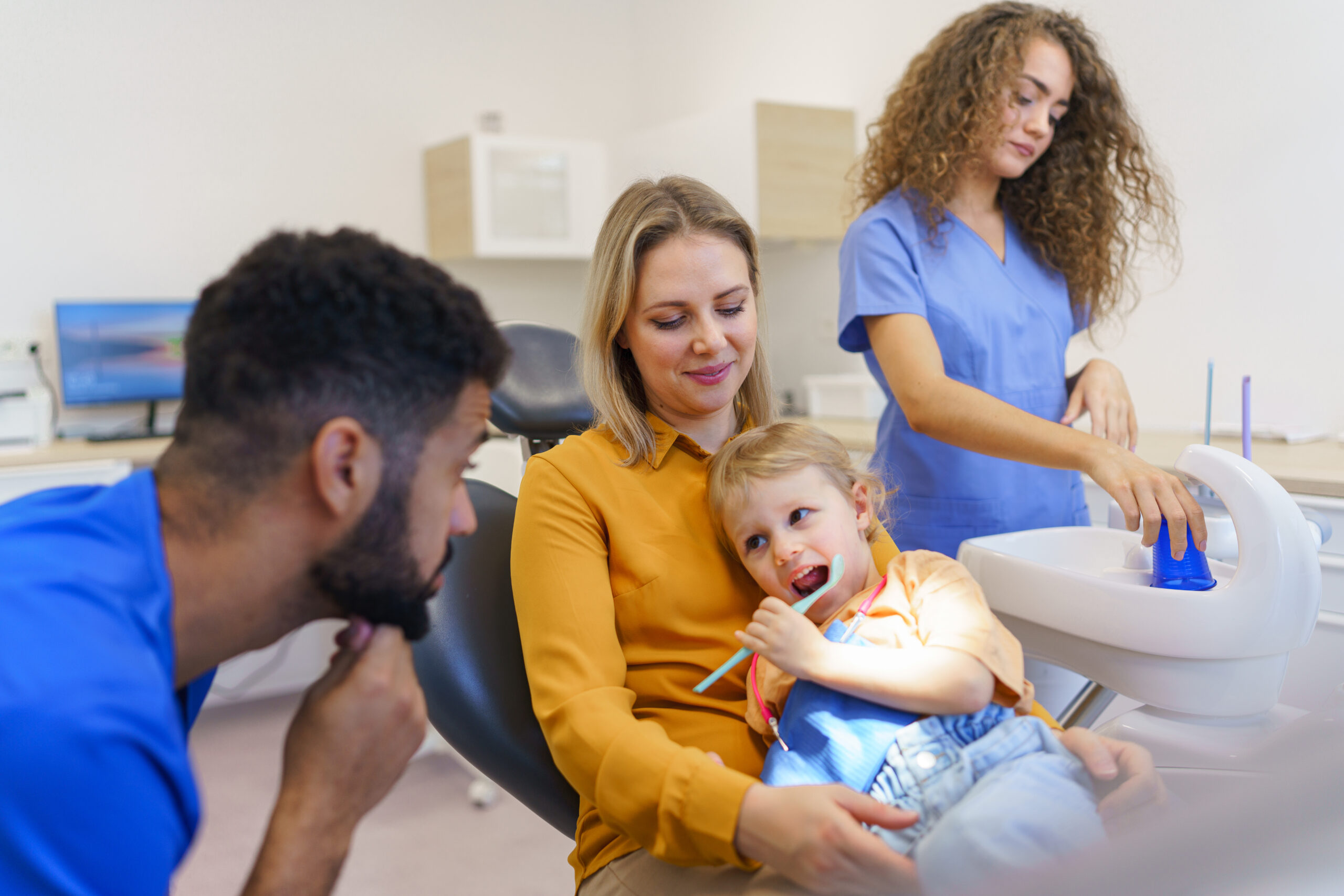 Oral surgeon performing surgery installing implant